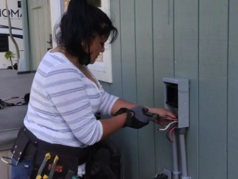 Licensed electrician wiring an exterior subpanel in Sutherlin