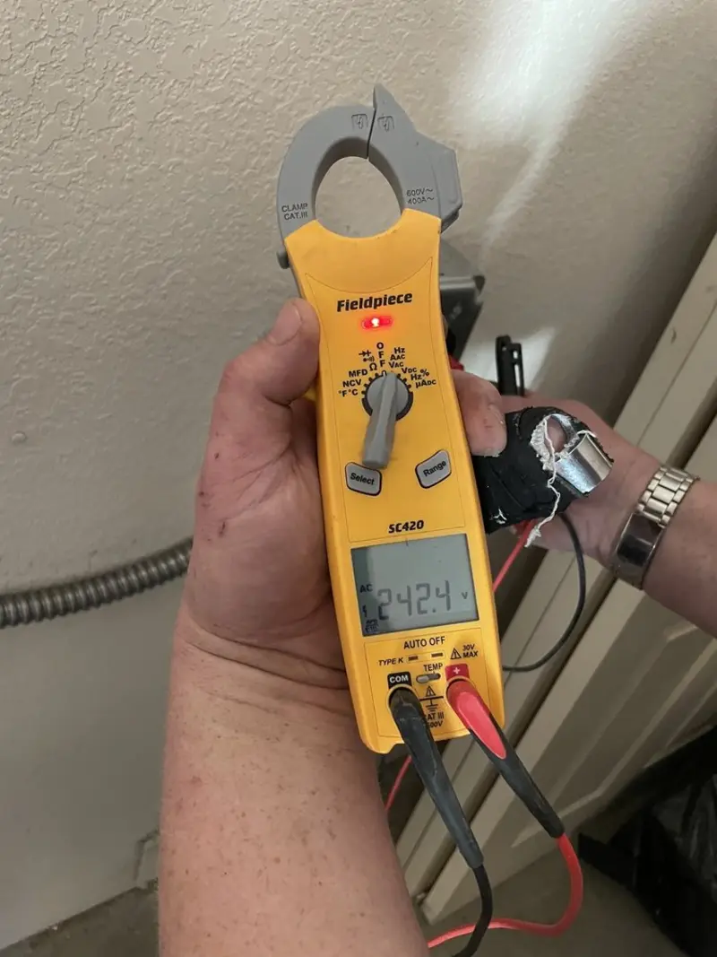 Voltage testing with clamp meter during Whole House Surge Protector in Sutherlin